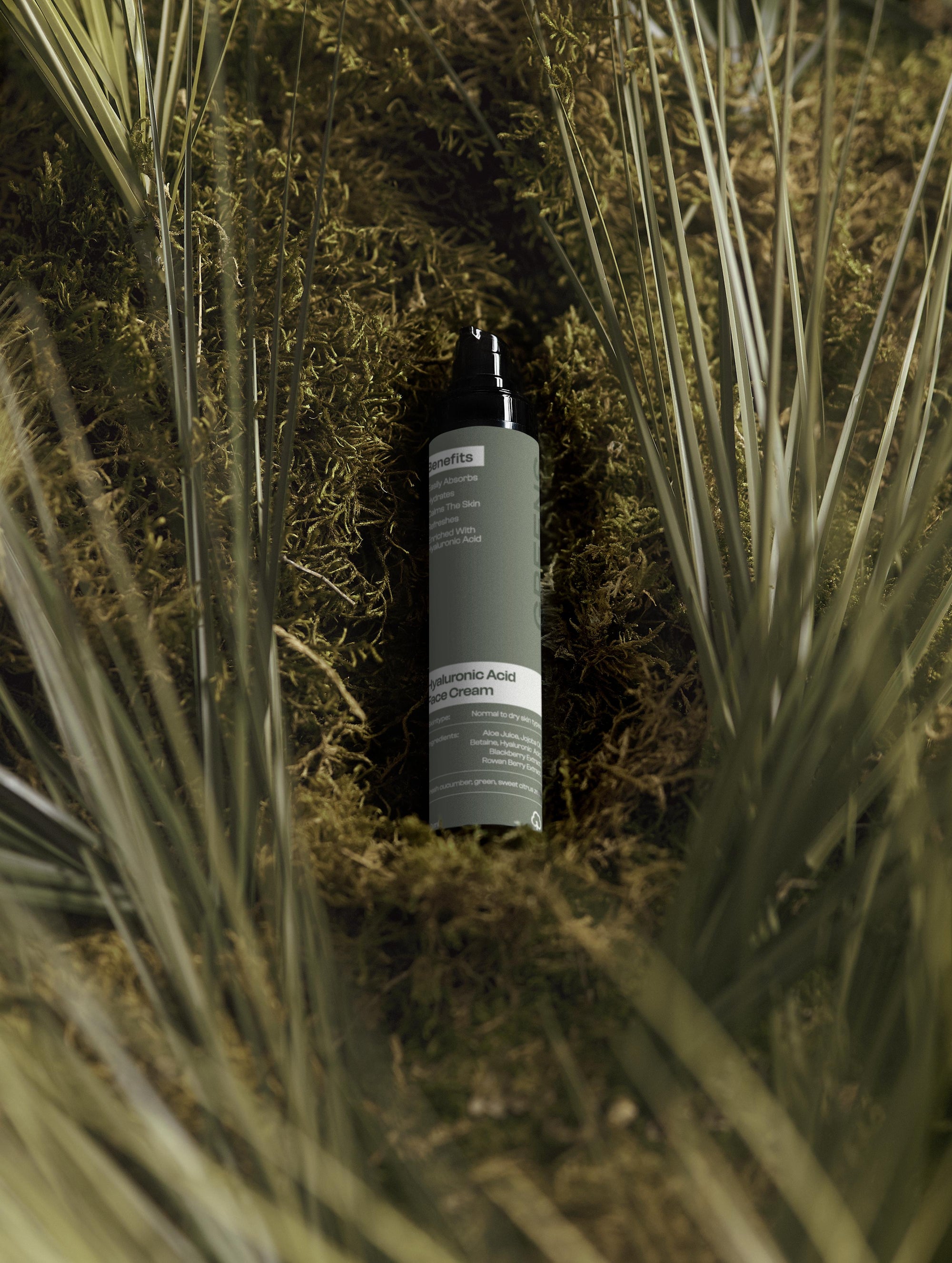 Artistic studio lighting on the Greens for People Hyaluronic Acid moisturizer for daily skincare.