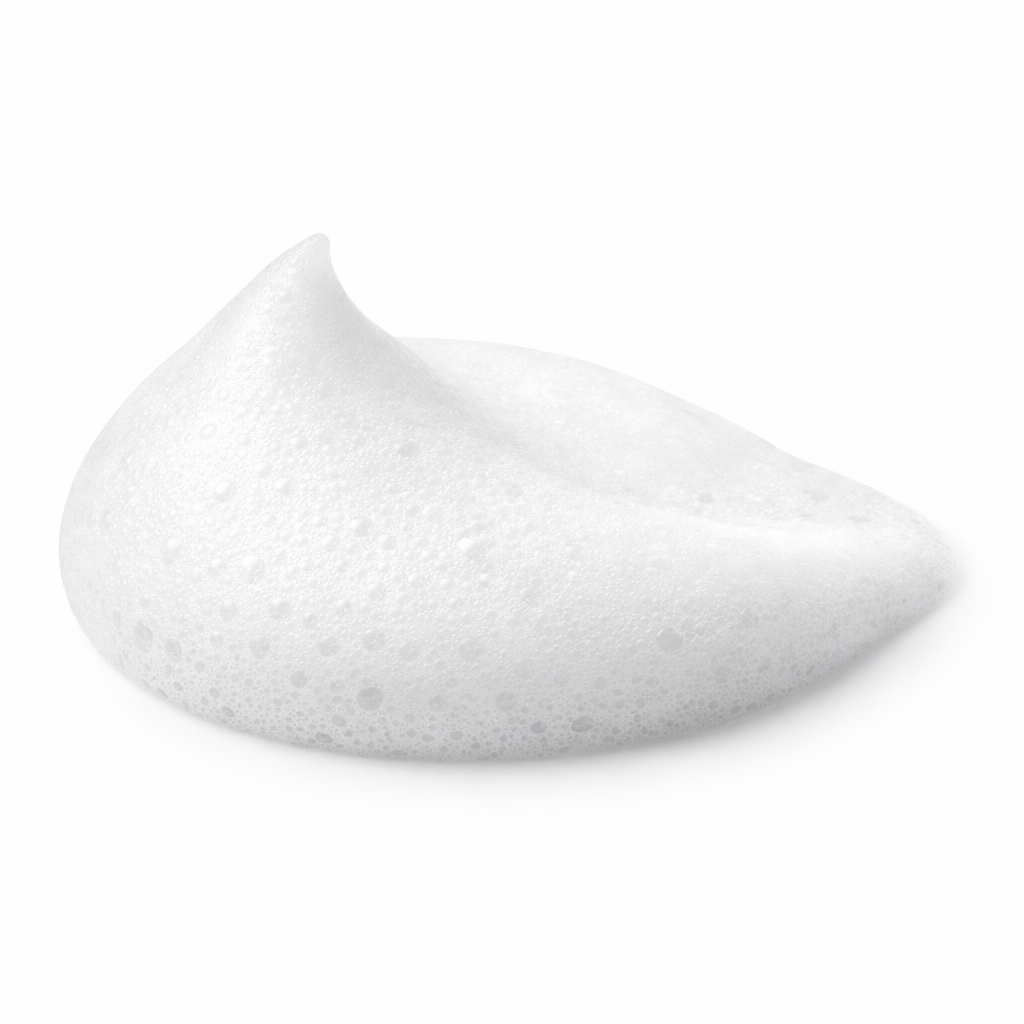Close-up texture shot of the rich and airy foam of Greens for People men's cleansing face wash.
