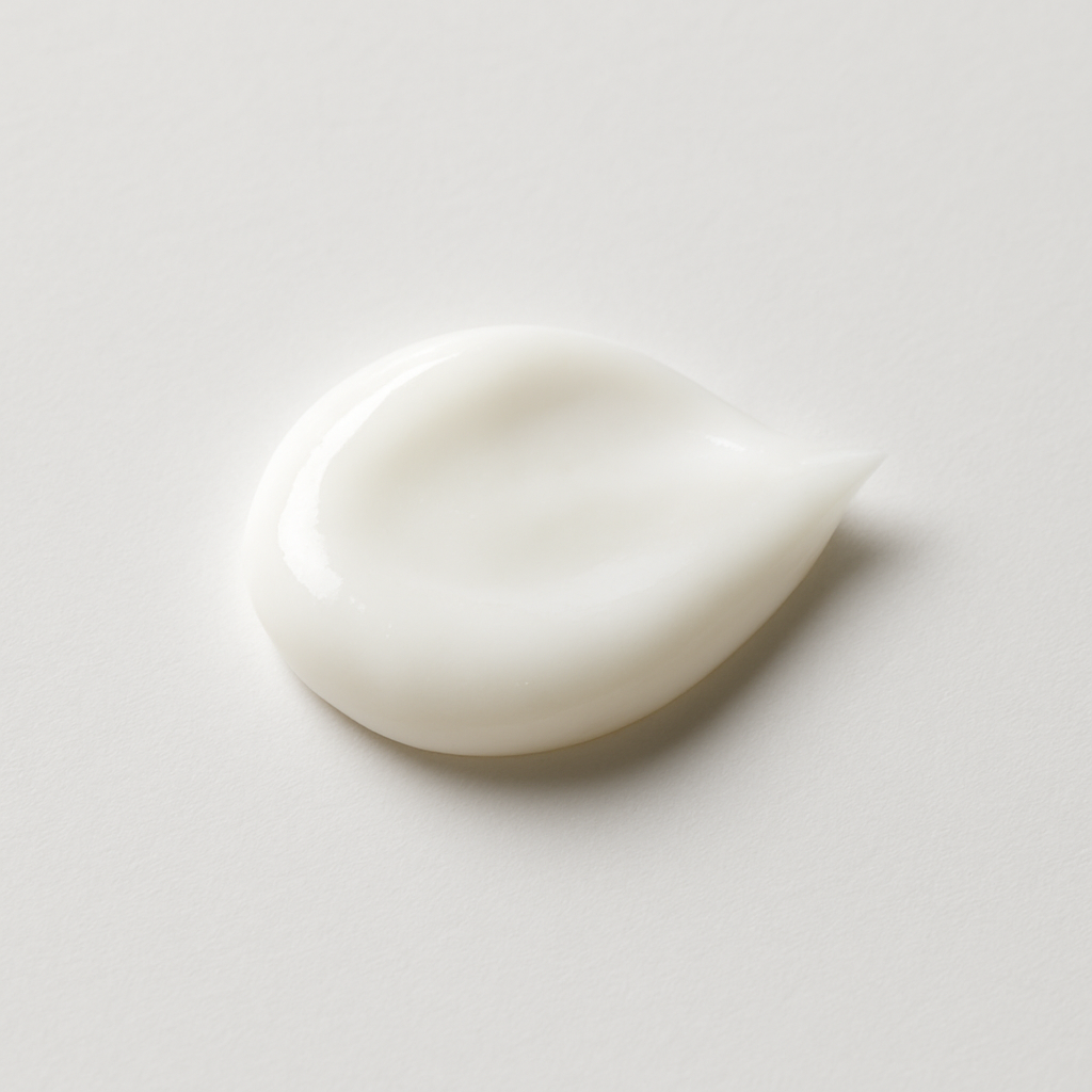 Close-up texture shot of the rich and smooth Greens for People Hyaluronic Acid face cream for men.