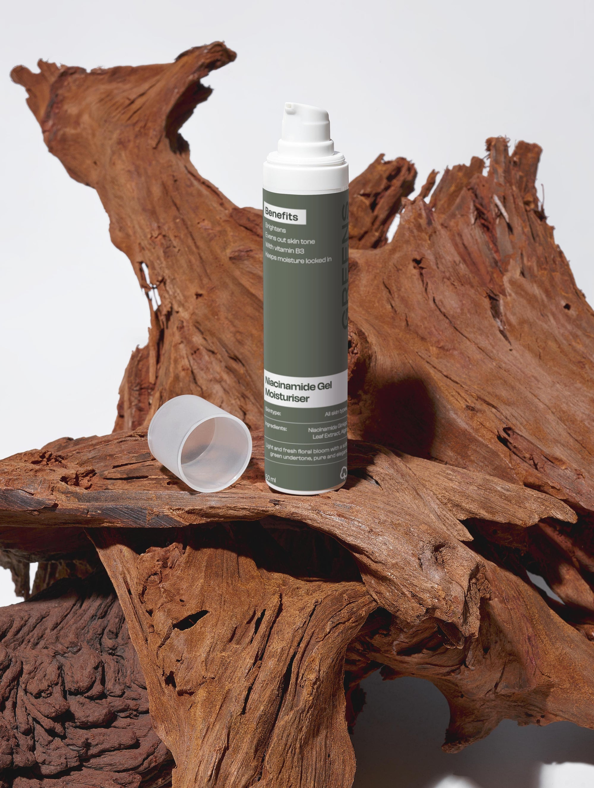 Studio shot of the Greens for People men's Niacinamide skincare product with artistic lighting and shadows.